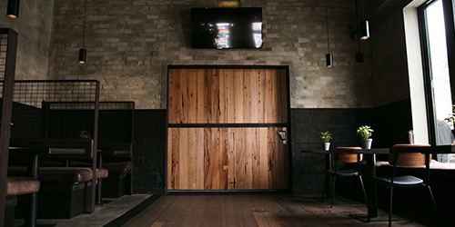 roamn-images-timber-revival-fitout-shopfitter-interior-recycled-timber-door-hospitality-cafe-bar-melbourne-tables-benchseats-northcote-social-club-breathe-architecture