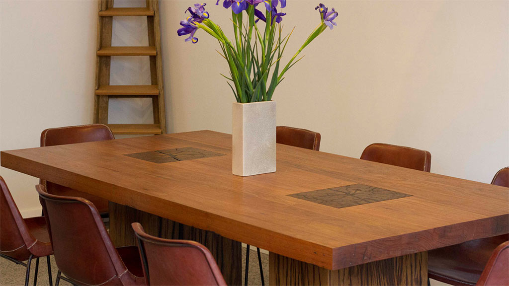 Recycled timber dining table with Ironbark post table legs