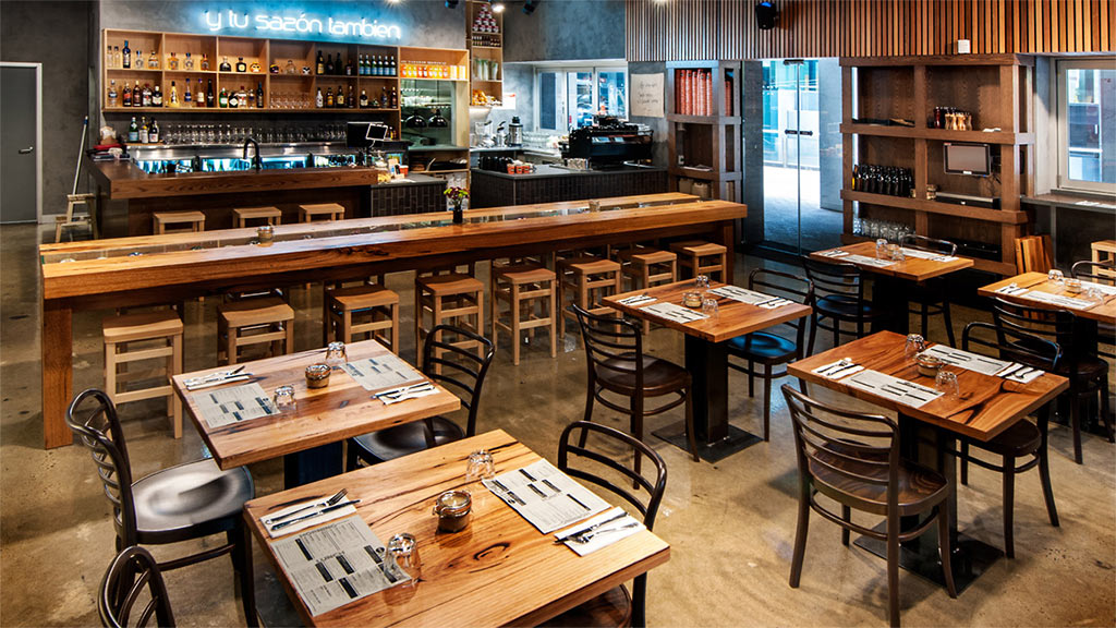 Recycled timber used for table tops in a hospitality venue